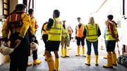Teignmouth lifeboat crew and shore crew in their boathouse. Photo: RNLI/Nigel Millard.