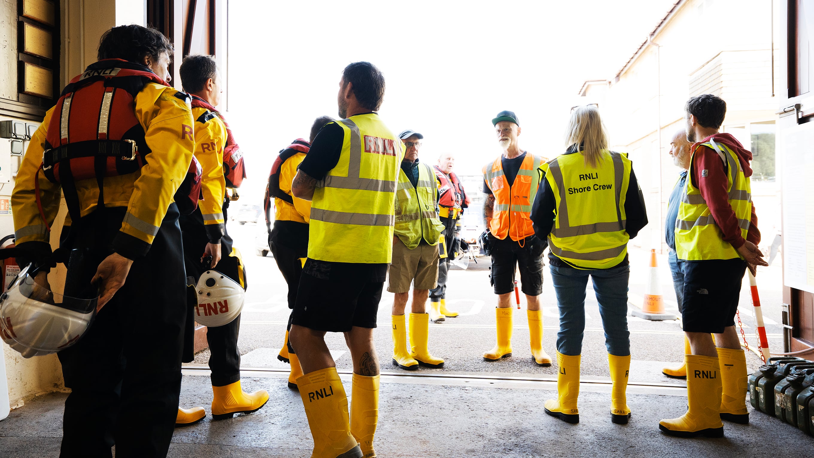 Teignmouth lifeboat crew and shore crew in their boathouse. Photo: RNLI/Nigel Millard.