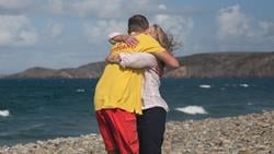 Lifeguard Matty hugs Joanna on the beach. It's an emotional reunion. 