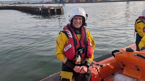 Crew Member Steve Nelson in a D class lifeboat. 