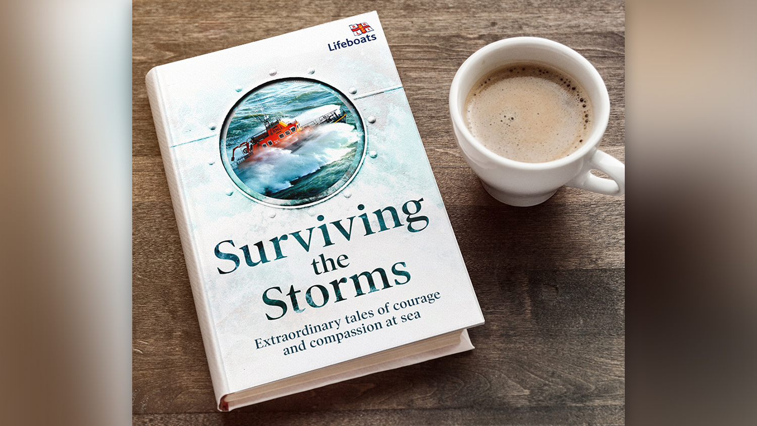 A copy of the book Surviving the Storms, with a cup of tea