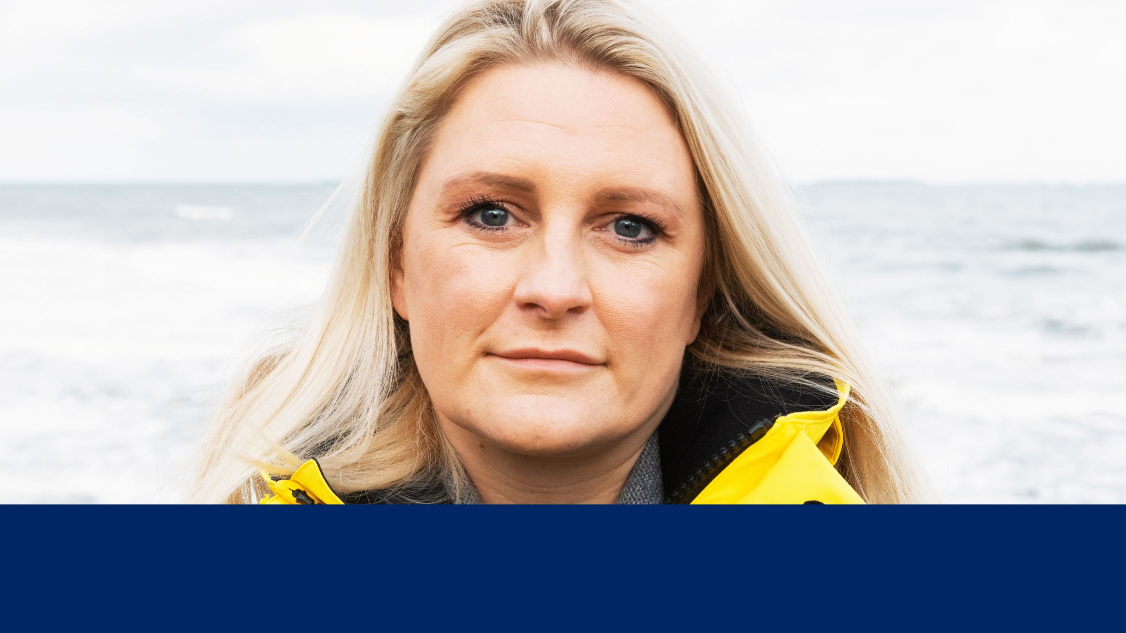 Close up portrait of female crew member looking straight to camera