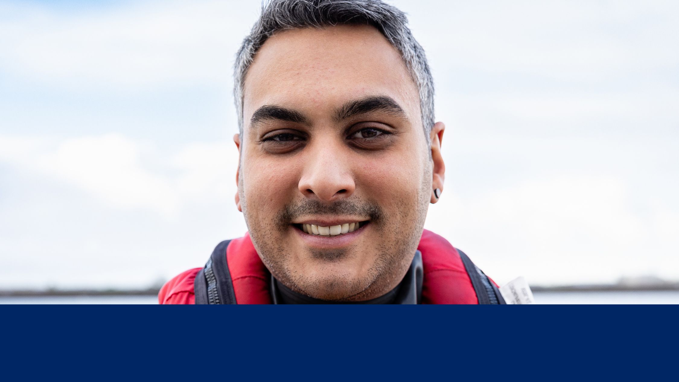 Close up portrait on male crew member looking straight to camera