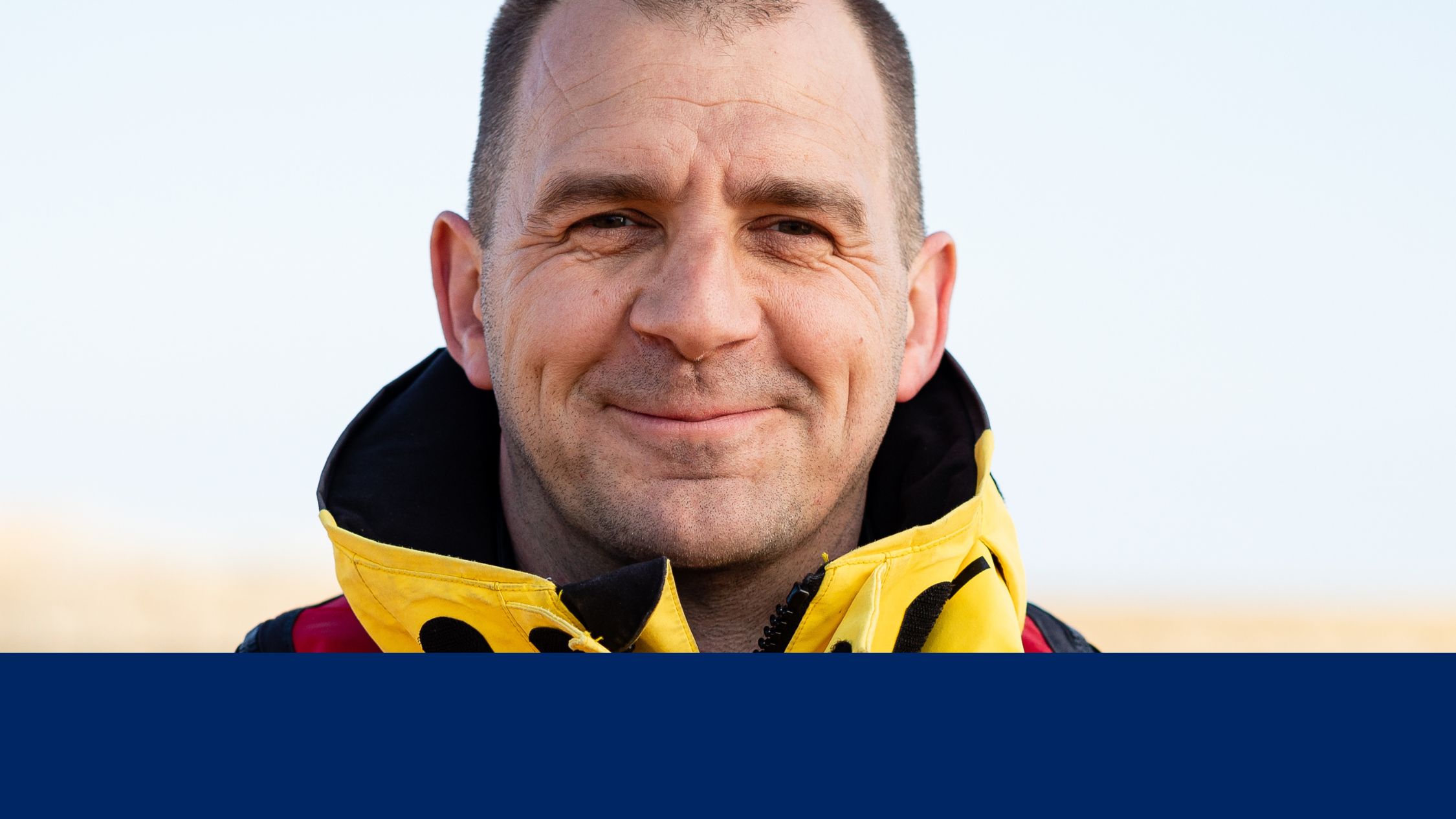 Close up portrait on male crew member looking straight to camera