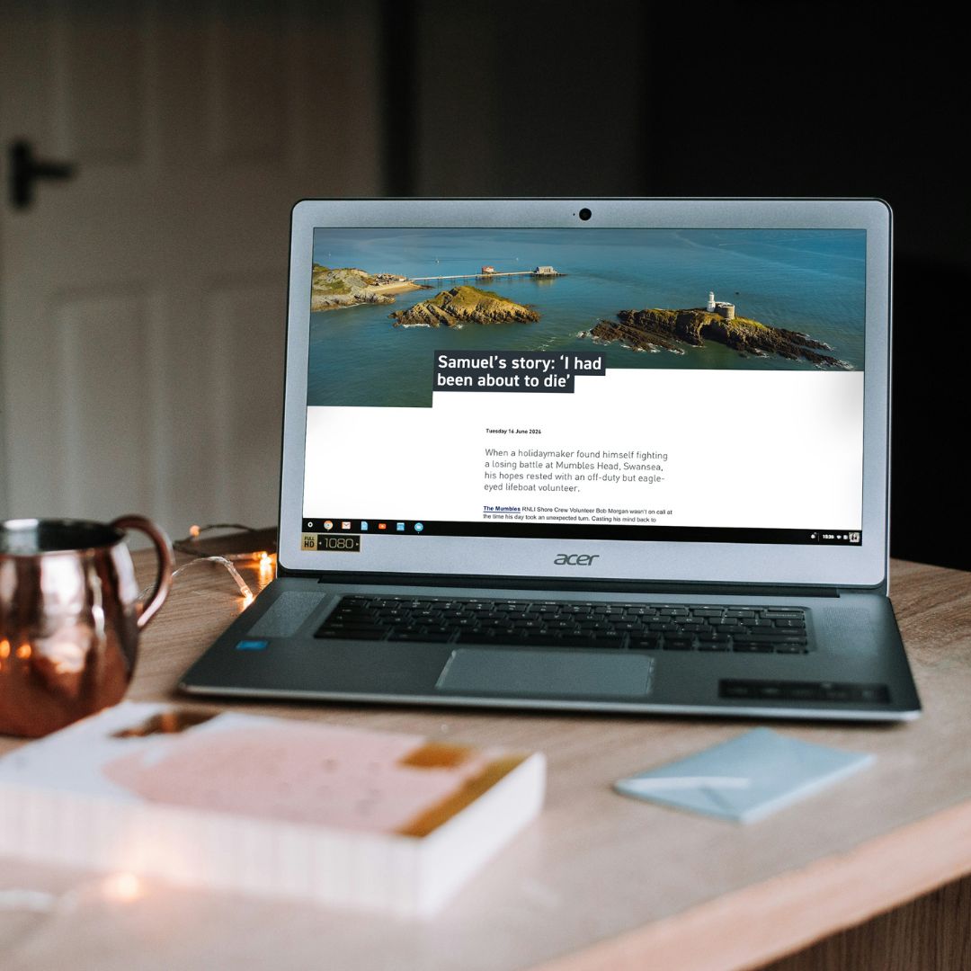 A laptop open on an RNLI article featuring a real-life rescue story kindly shared by Samuel.