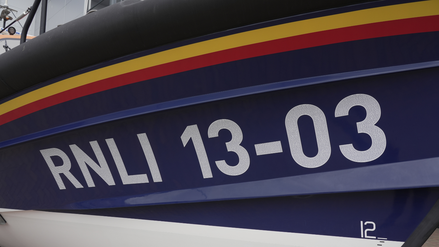 A zoom in photo of RNLI Exmouth Lifeboat’s Decal RNLI 13-03.