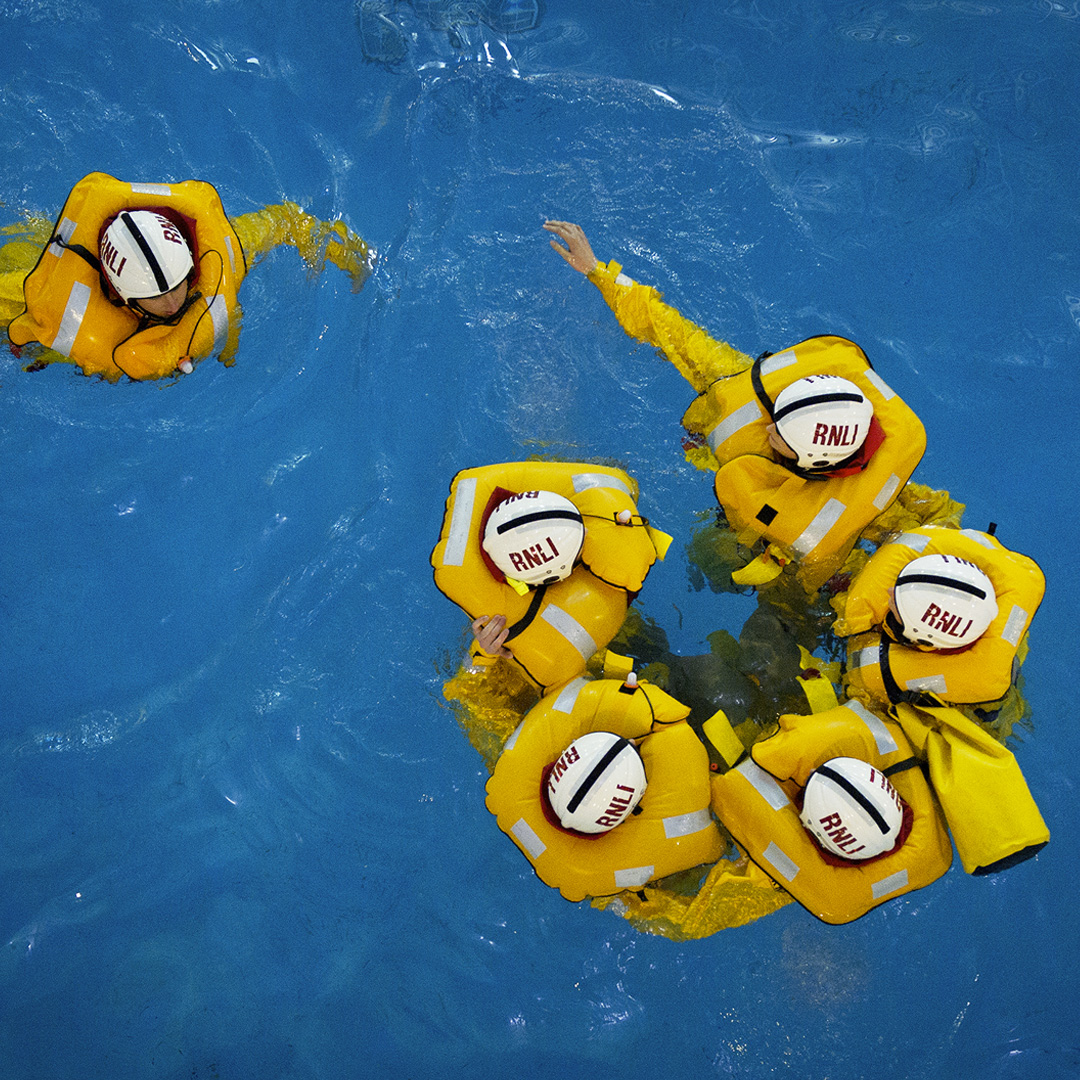 RNLI volunteers in a body of water taking part in training. 