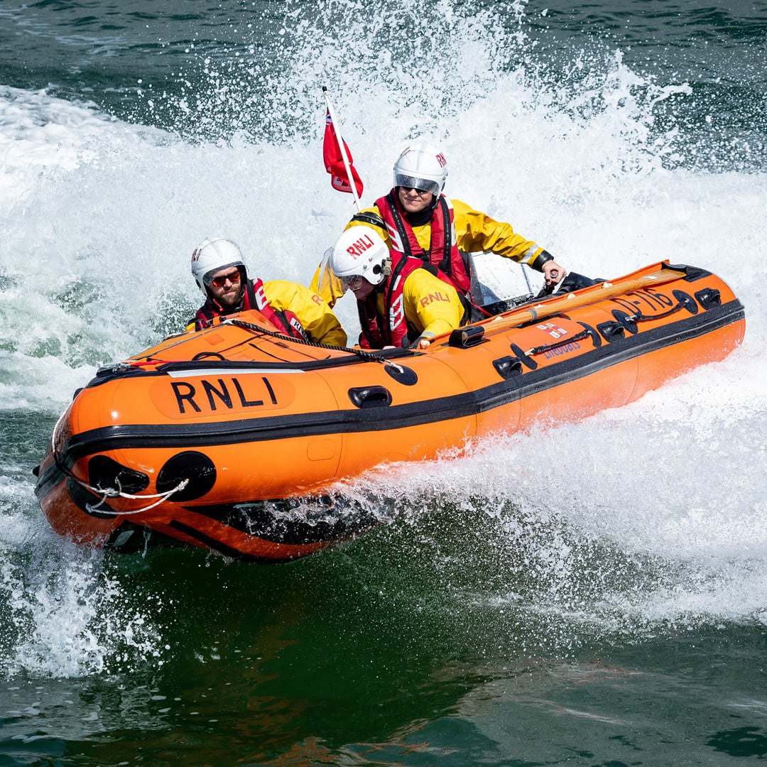 RNLI lifeboat crews out at sea in a lifeboat. 