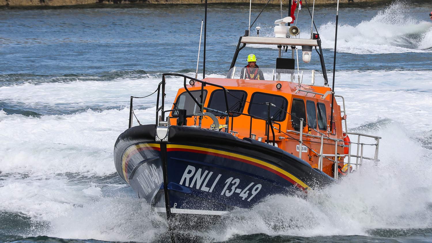 Whitby’s Shannon class Launch a Memory lifeboat cruising through Whitby Harbour 