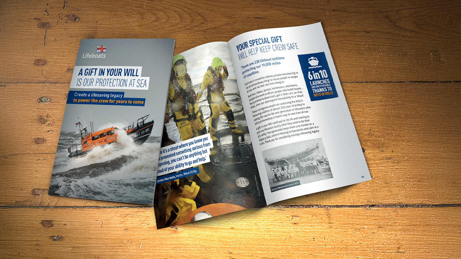 Two copies of the RNLI guide to gifts in Wills on a wooden table. One is closed, showing the front cover, and one is open showing some of the contents. 