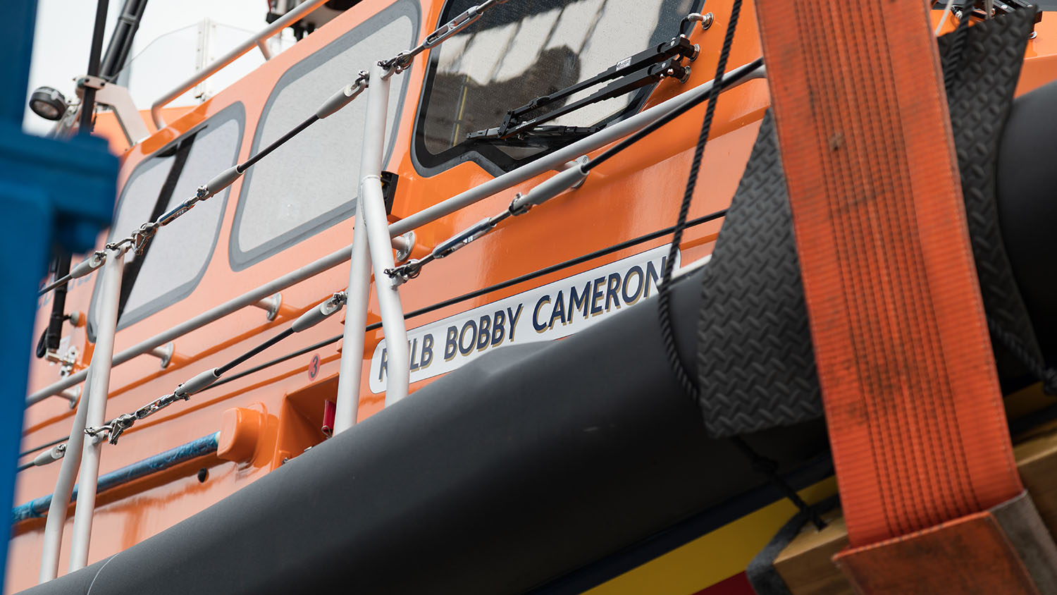 A close-up shot of the side of Kilkeel’s new Shannon class lifeboat Bobby Cameron. The name of the boat ‘RNLB Bobby Cameron’ is printed on the side of the lifeboat.