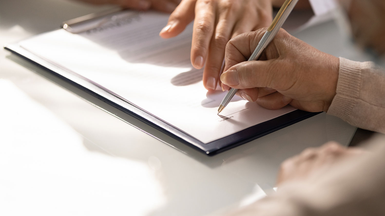 Clipboard with form being filled out