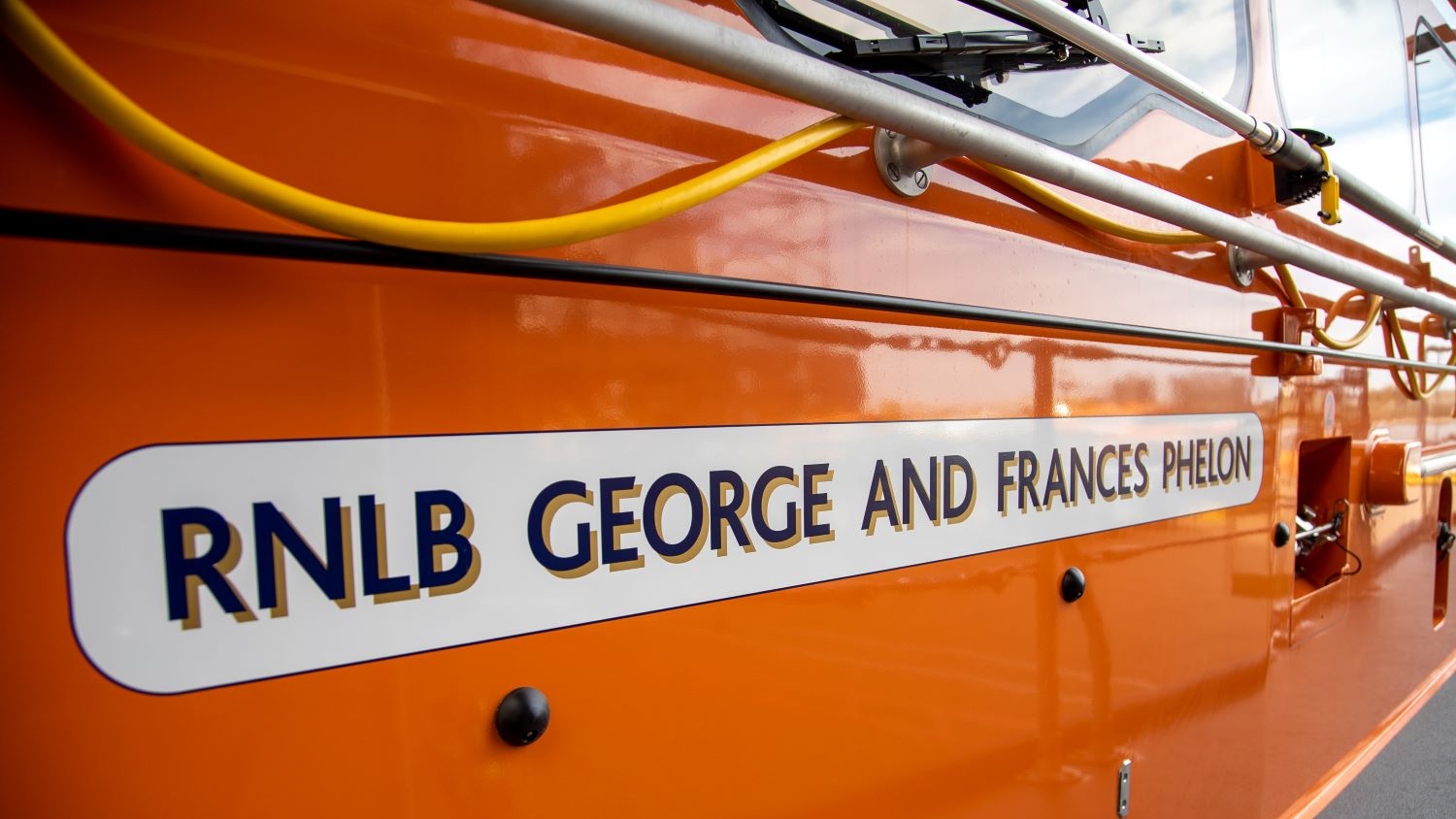 Decal with legacy names on being applied to the Great Yarmouth and Gorleston Shannon class lifeboat George and Francis Phelon 13-44 a the Al-Weather Lifeboat Centre (ALC) in Poole.
