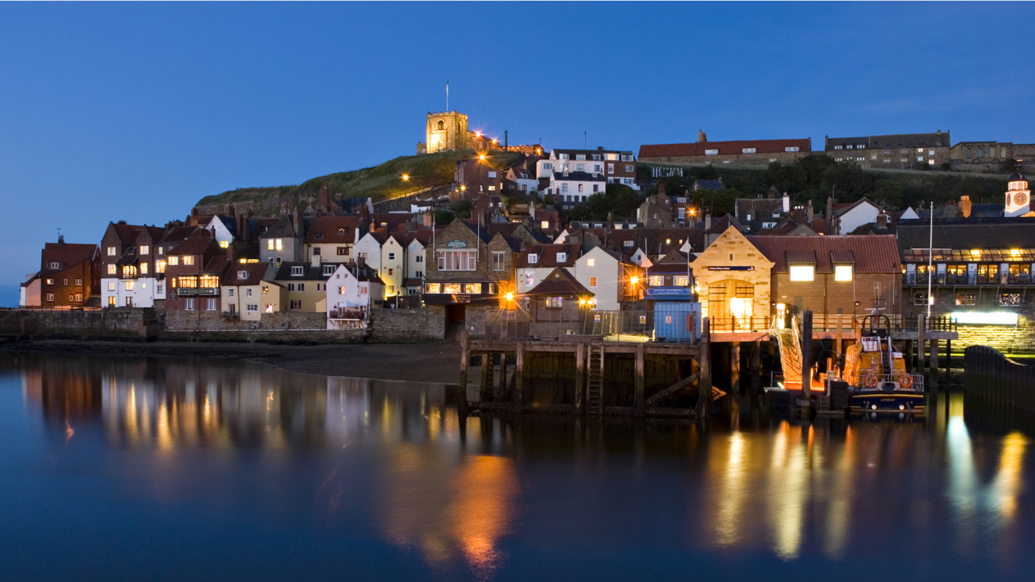 Whitby Lifeboat Station at night, featuring Trent class lifeboat George and Mary Webb.