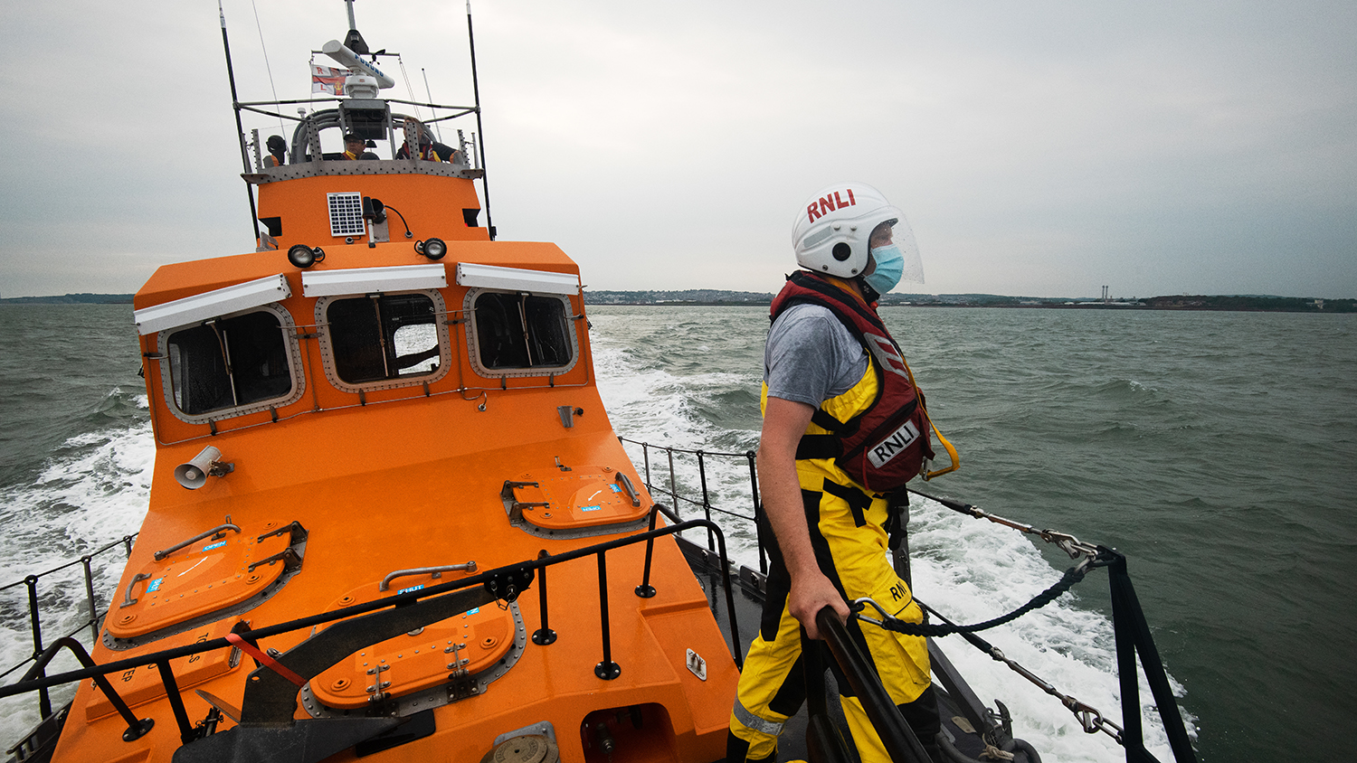 An RNLI crew member on the deck of Barry Dock’s all-weather Trent class lifeboat