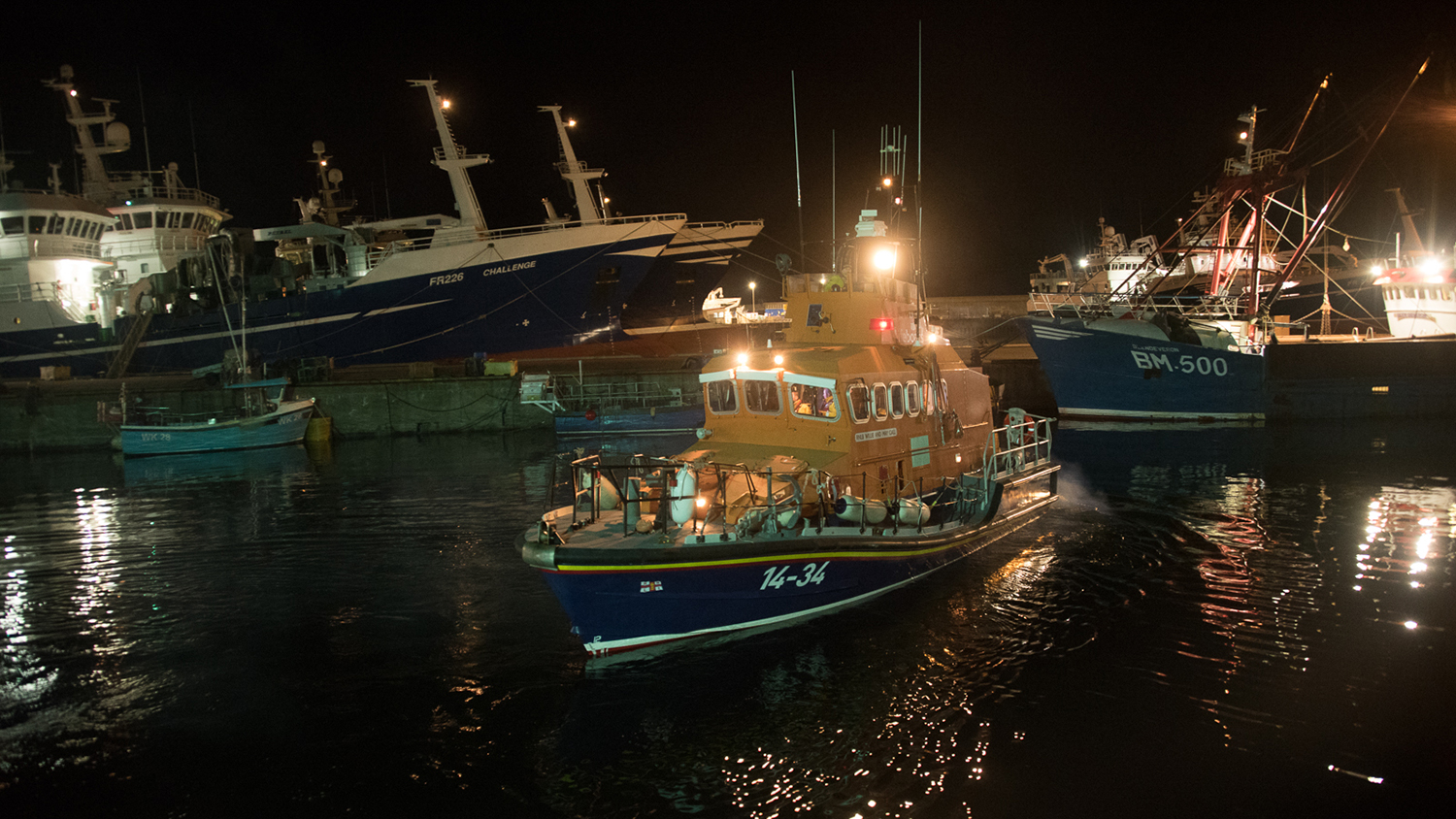 Fraserburgh’s Trent class lifeboat leaving the harbour at night