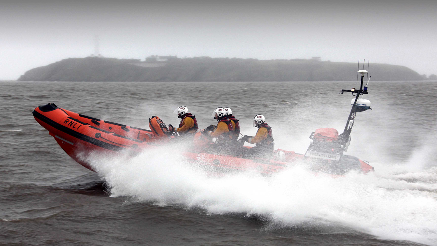 Penarth’s Atlantic 85 lifeboat Maureen Lillian powers through the water on a grey day