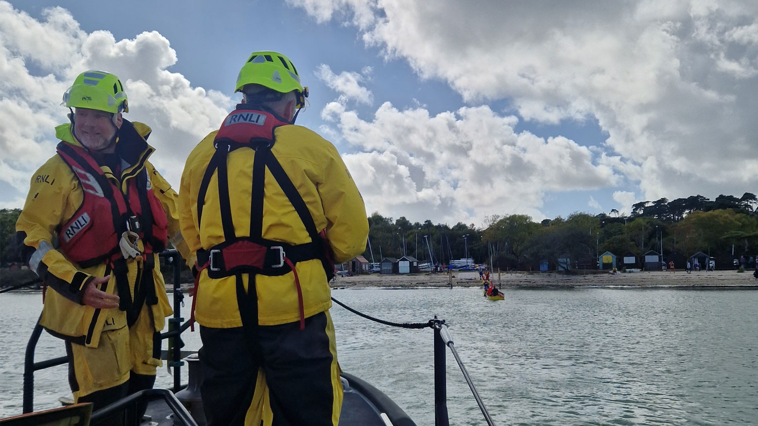 Two Swanage RNLI lifeboat crew members aboard their all-weather lifeboat 