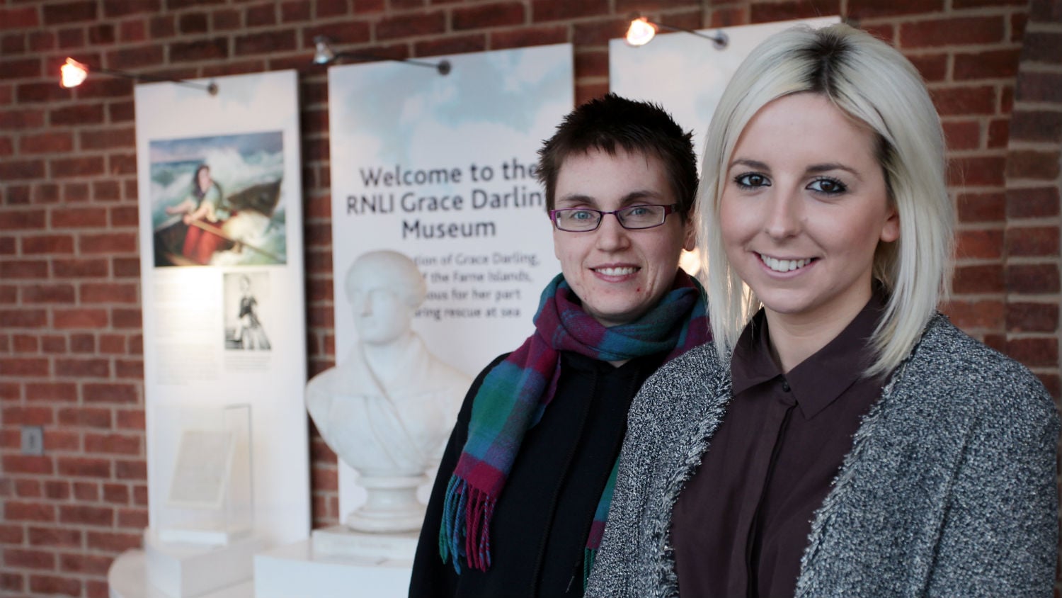 RNLI heritage volunteers outside the RNLI Grace Darling Museum at Bamburgh, Northumberland