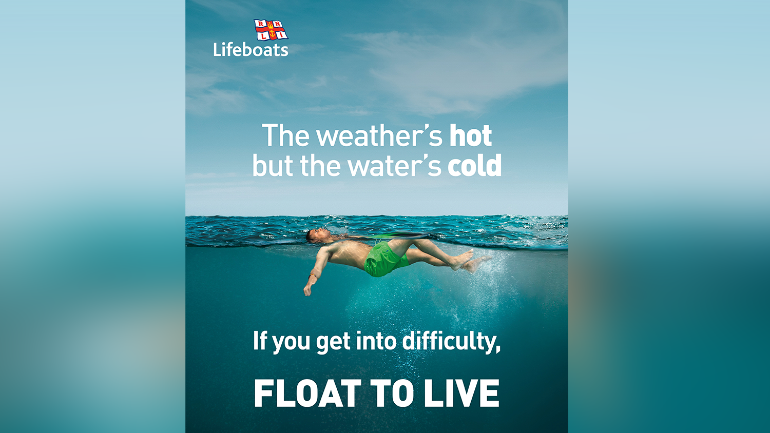 A person wearing board shorts floating in open water with text. 'The weather's hot, but the water's cold. If you get into difficulty, Float to Live.'