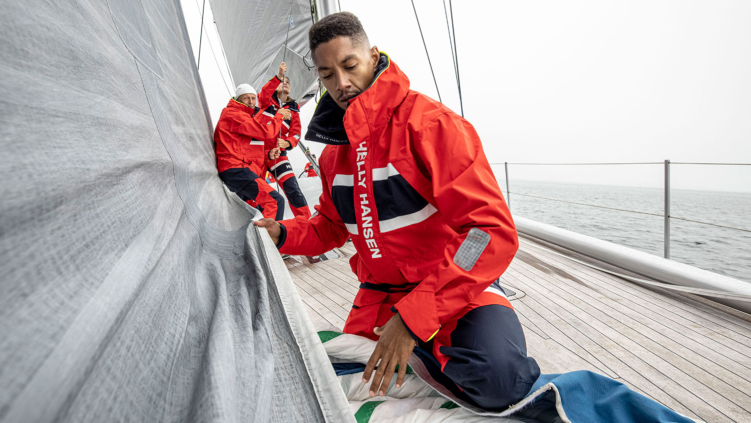 People on a boat in Helly Hansen kit