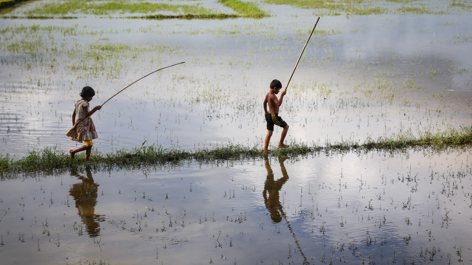 Children playing on flood plains in Bangladesh
