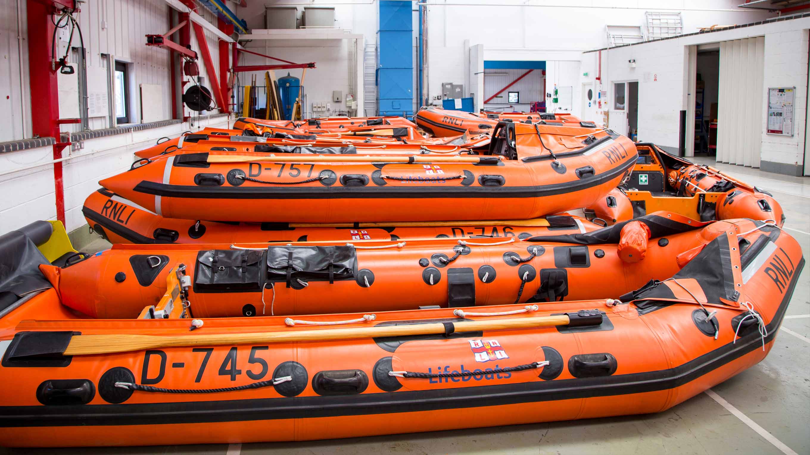 Recently built D class lifeboat RIBs on the floor of the Inshore Lifeboat Centre