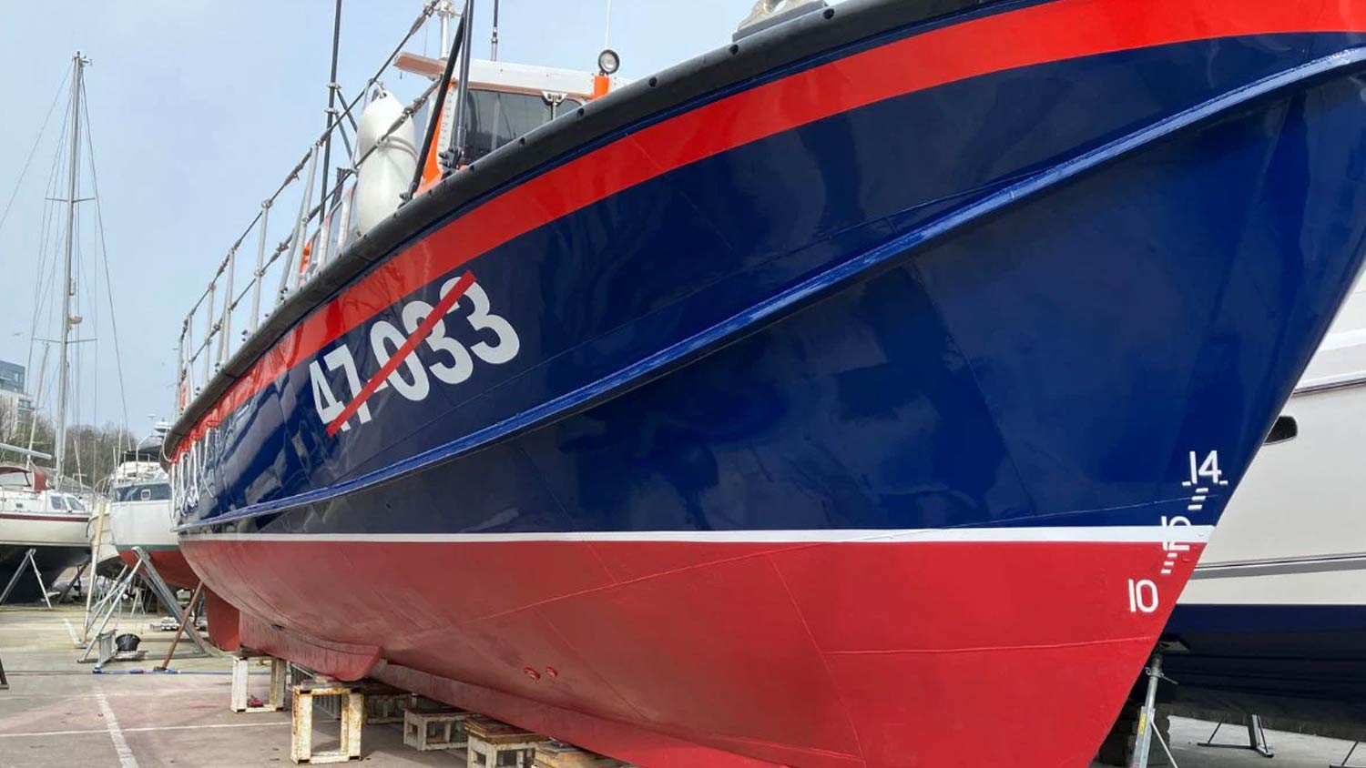 A look at the repainted hull of the Mary Irene Millar ex-service lifeboat, which sits on struts on dry land. The colours have been repainted bright red and blue.