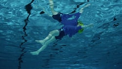 a person swimming under water.