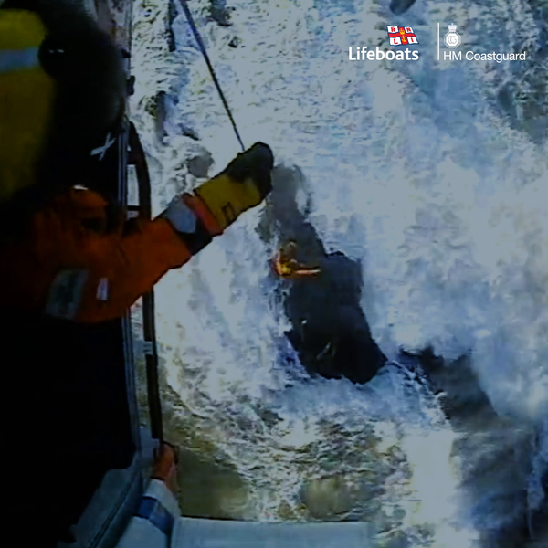 Lifesaver winches up casualty from a rough sea